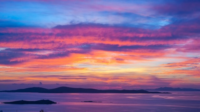 Bright colorful sunset on the sea with beautiful clouds